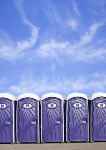 Row of Portable Plastic Toilets